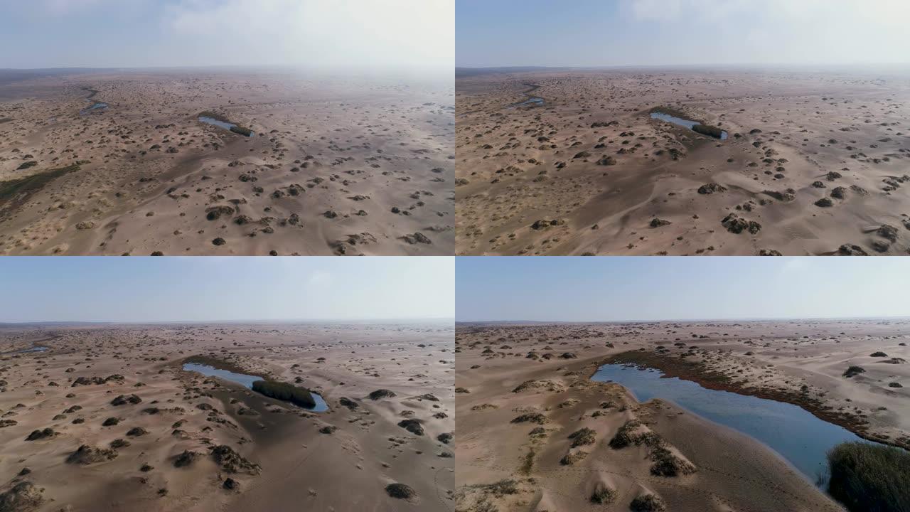 纳米比亚骷髅海岸纳米布沙漠快速沙洲绿洲的4k空中飞行