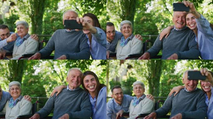 坐在轮椅上的快乐孙子和祖父母的慢动作都很有趣，可以用手机拍照，或者让视频通话祖父母都坐在公园的轮椅上
