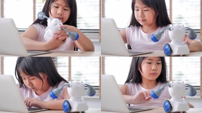 女孩在家中在计算机上进行构建和编程，并将其作为学校科学项目来构建机器人。她对自己的工作非常满意。教育