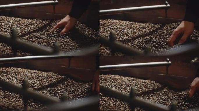 工人用手混合烘焙咖啡豆