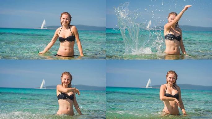 顽皮的女人在阳光明媚的夏日以慢动作将海水溅向相机