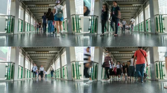 在BTS曼谷空中步道高峰时段，高架地铁系统站高架立交桥上的匿名人群拥挤，交通和乘客旅行概念