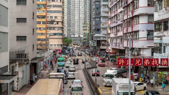 延时: 香港九龙弥敦道旺角法源街市的行人及交通背景