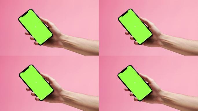 一只手展示了绿色屏幕的现代手机