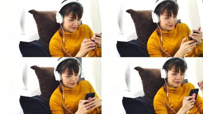 亚洲女性用耳机听音乐