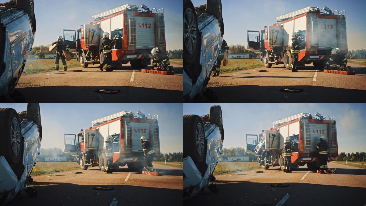 消防员救援队乘坐消防车抵达车祸现场。消防员从消防车上抢走他们的工具，设备和装备，急忙帮助受伤，被困人