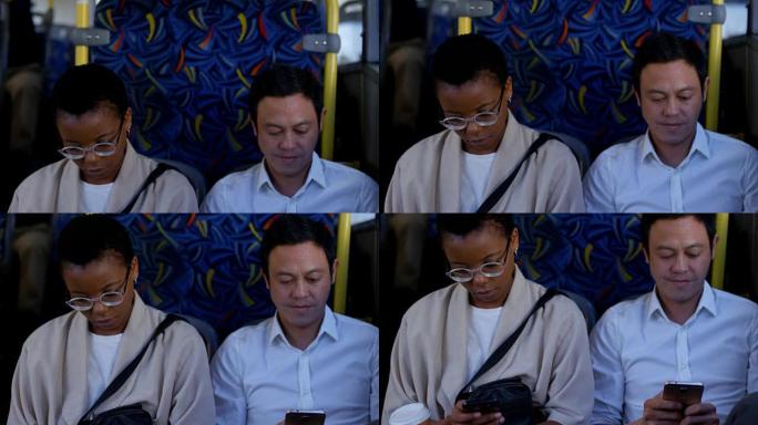 乘坐4k公交车时使用手机和数字平板电脑的通勤者