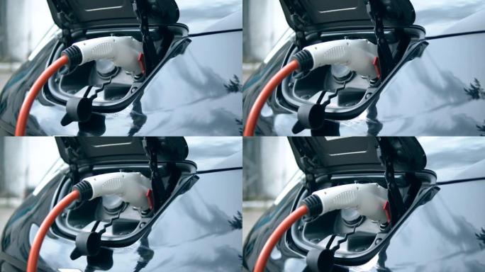 白色电缆插入电动汽车的充电插座。