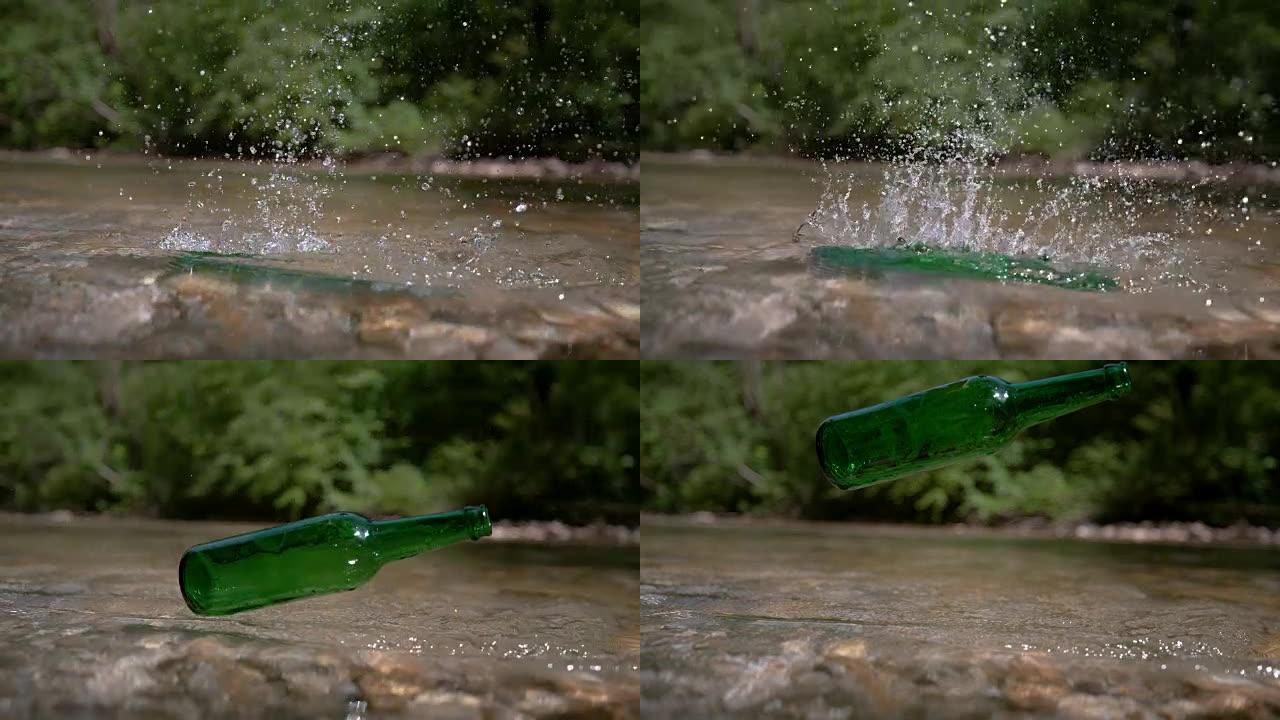 反向慢动作: 绿色瓶子掉入纯净的山溪中。