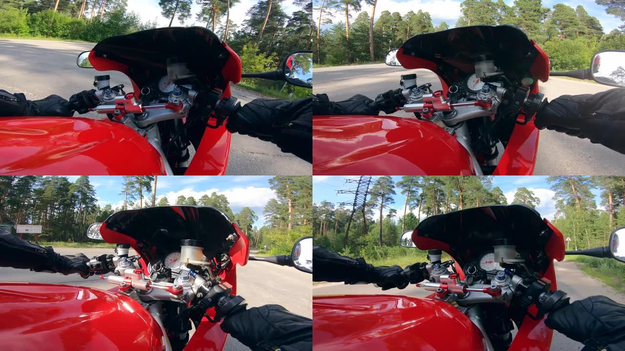 骑摩托车时，驾驶员握着车把。