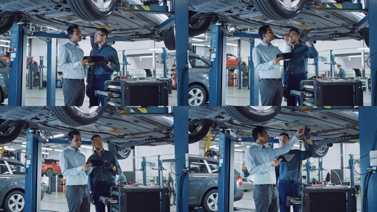 经理检查平板电脑上的数据，并向机械师解释故障。汽车服务员工检查汽车的底部和防滑板。现代清洁车间。