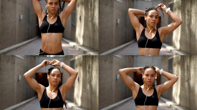 年轻的非洲裔美国妇女在4k城市捆绑她的updo的前视图