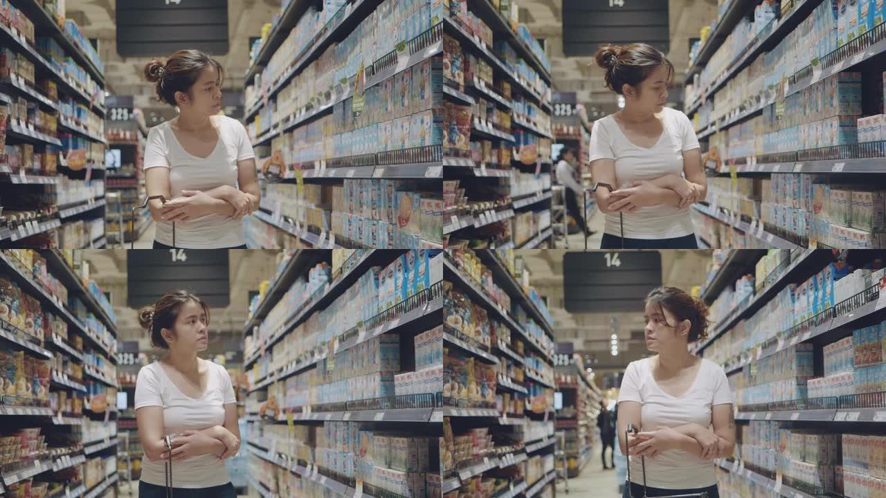 超市货架上的年轻女子