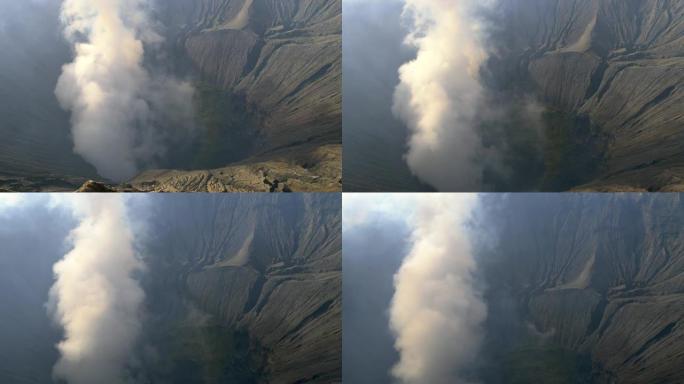 一座活火山冒出的大烟云。印度尼西亚东爪哇省布罗莫腾格里塞梅鲁国家公园的布罗莫火山火山口。倾斜镜头，4