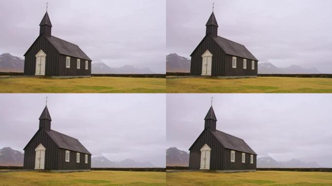 冰岛偏远山区景观中的教堂女士