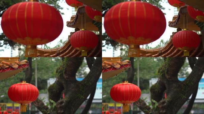 美丽的圆形红灯笼挂在古老的传统寺庙上，中国农历新年的概念