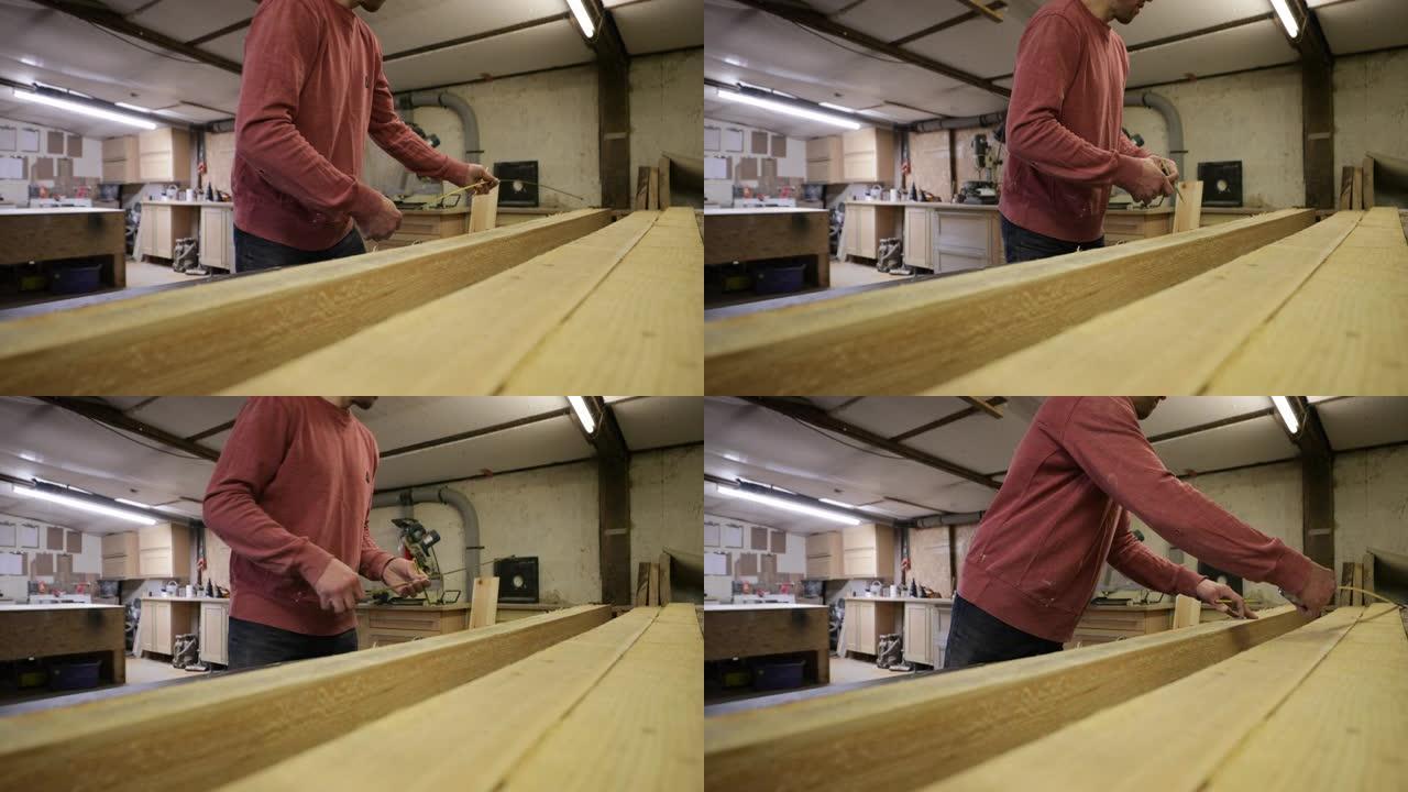 木匠在工作中测量生产车间木工家具生产安装