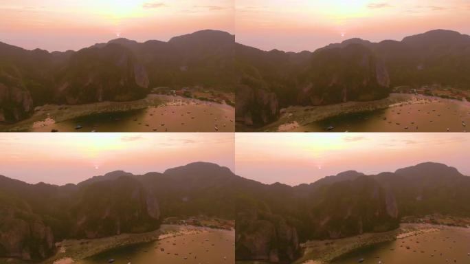 泰国甲米府披披岛全景。壮观的彩色日落在大海和岛屿上。热带和平静的印度洋的惊人黄昏。空中4k视图