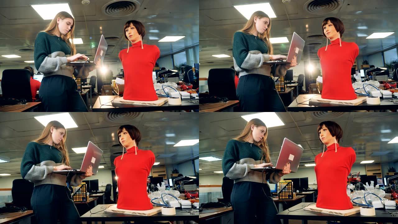 女工程师在笔记本电脑上打字，与机器人一起工作，特写镜头。