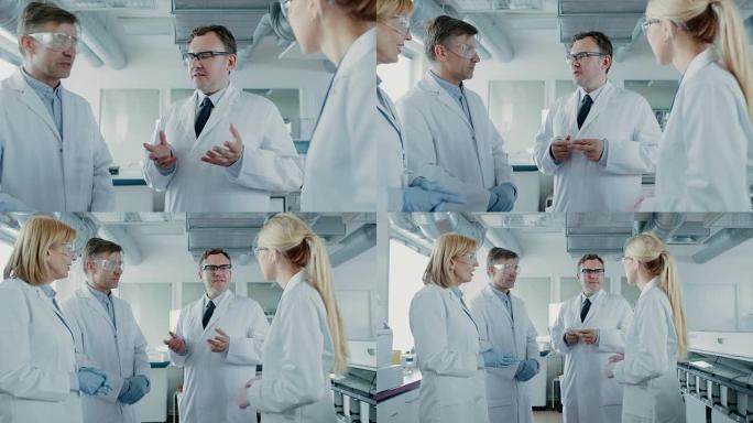 研究科学家团队开会，他们站在实验室中间进行讨论。创新现代实验室的人做遗传学和药学研究。