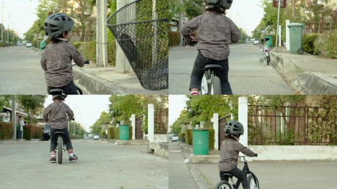 骑自行车的小男孩平衡车小孩教育户外活动