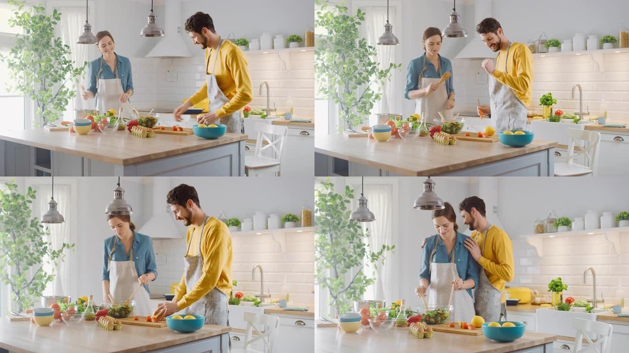 在厨房: 幸福的夫妻准备健康的食物，大量的蔬菜。男人玩水果，让她的女朋友笑。恋爱中可爱的人玩得开心