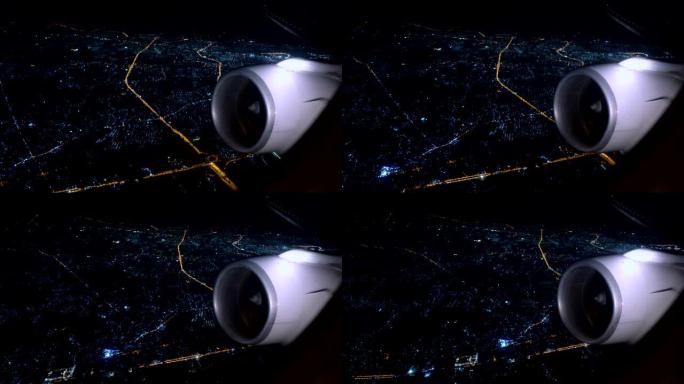 带cityscpae灯的夜间飞行飞机涡轮机
