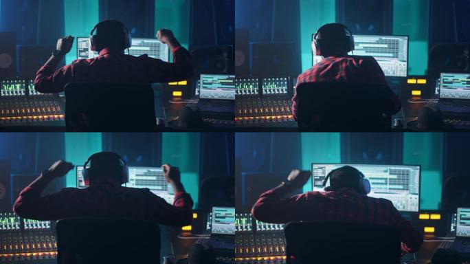 音乐录音室的艺术家，音乐家，音频制作人，使用带有计算机屏幕的控制台，显示带有歌曲播放的软件UI。举手