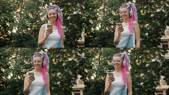 带着智能手机在户外跳舞的快乐年轻女子戴着耳机