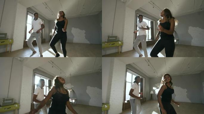 快乐的黑人男女在工作室跳舞