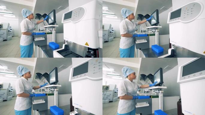 女人在显示器上打字，而医疗设备在实验室工作。4K。