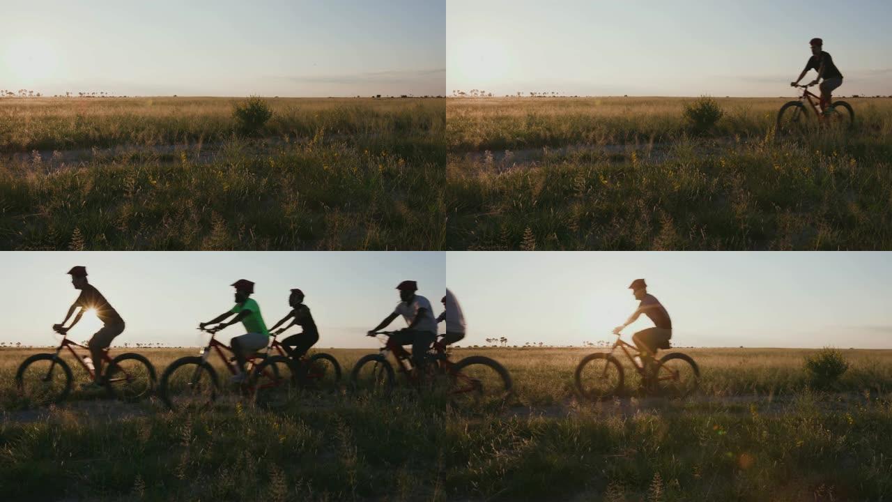 博茨瓦纳Makgadikgadi平底锅边缘享受自行车骑行的游客的4k空中日落侧视图
