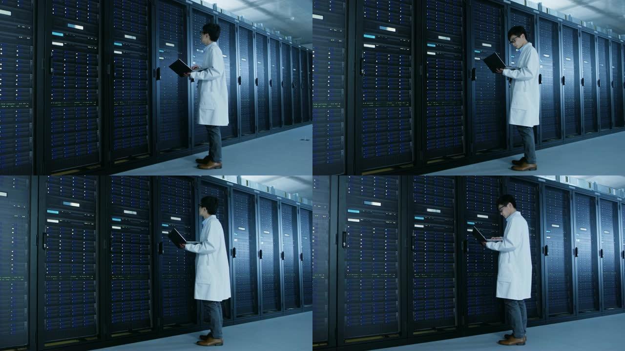 在数据中心: 穿着白大褂的男性IT专家站在服务器机架旁边，使用笔记本电脑运行维护诊断工具，进行控制，