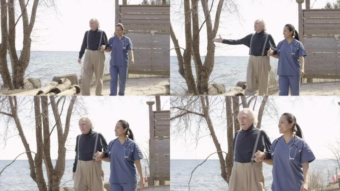 老人与护士一起在户外散步