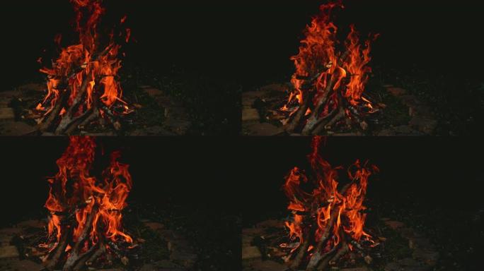 时间重新映射，关闭: 大型篝火在砖砌的火坑内燃烧。