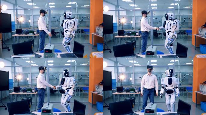 男工人和机器人在房间里握手。VR游戏概念。