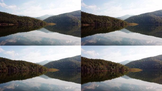 空中拍摄的镜湖与森林和山脉，蓝天