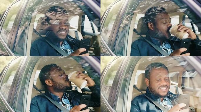 英俊的黑人男子坐在汽车上，坐在乘客座位上，使用智能手机，喝咖啡。从车外拍摄的摄像机。