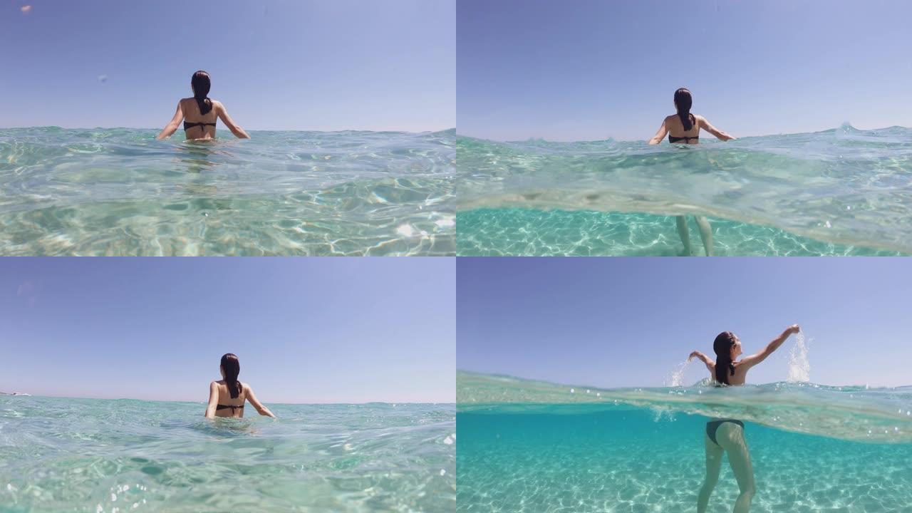 度假期间，年轻女子的慢动作在热带海水的透明蓝色海水中漂浮着腹部放松