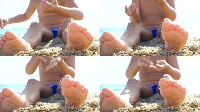 一个美丽的小女孩在海边的沙滩上玩耍的肖像，可爱的微笑，大海的背景是黄沙和蓝色的水。