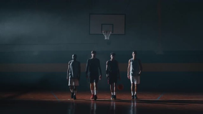 年轻职业男球员的电影慢动作镜头正在健身房练习篮球锻炼