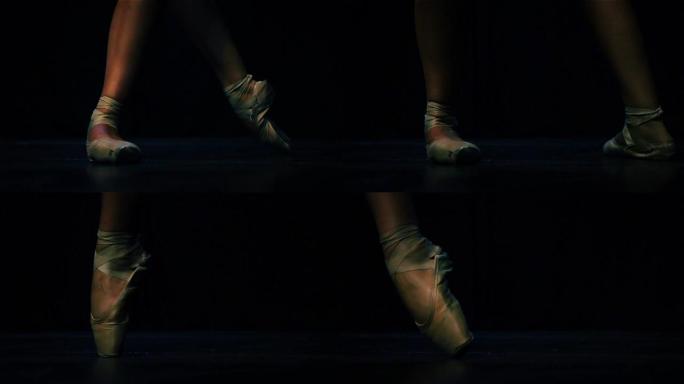 芭蕾舞演员的脚穿着足尖鞋跳芭蕾舞。