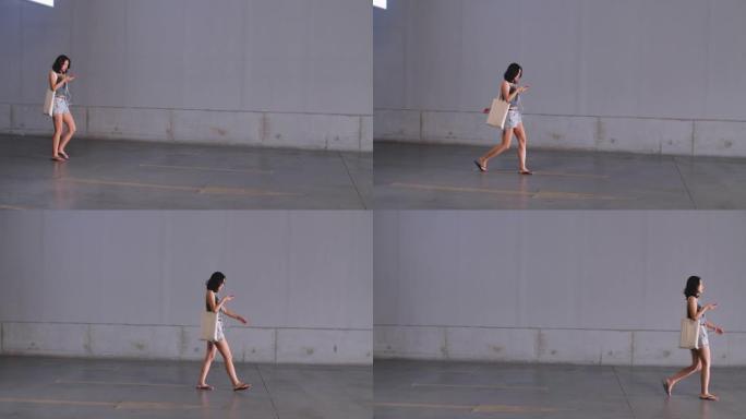 年轻亚洲女子看手机走路，4k