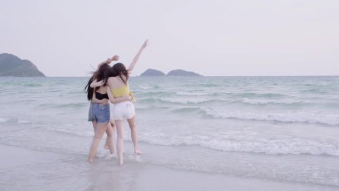 4k分辨率亚洲女性快乐团友享受暑假和在沙滩上散步
