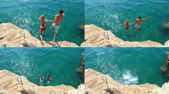 慢动作: 旅游夫妇决定跳下岩石悬崖，潜入大海。