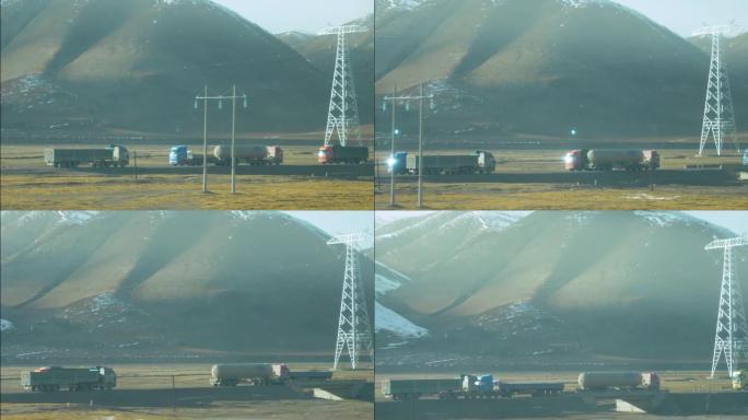 慢动作: 大型卡车在运送货物穿越藏族平原时相遇。