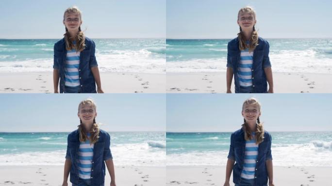 女孩站在海滩上看着相机