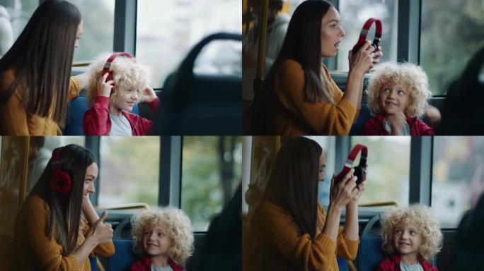儿子给母亲戴耳机，以便她可以在公共汽车上听音乐