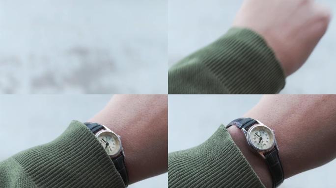 手表上男性手检查时间的特写。
