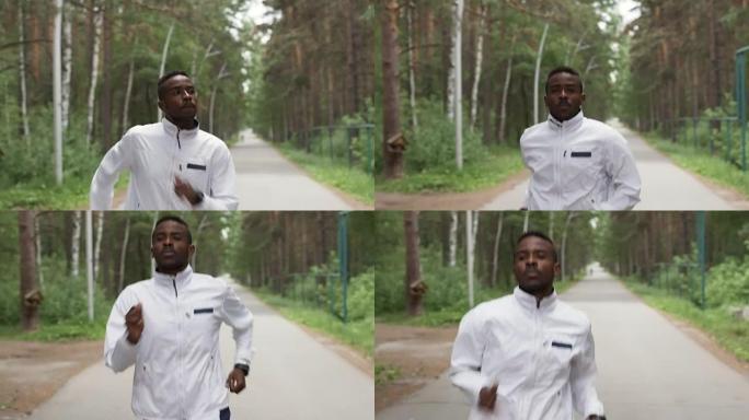 穿着风衣的黑人在森林里慢跑